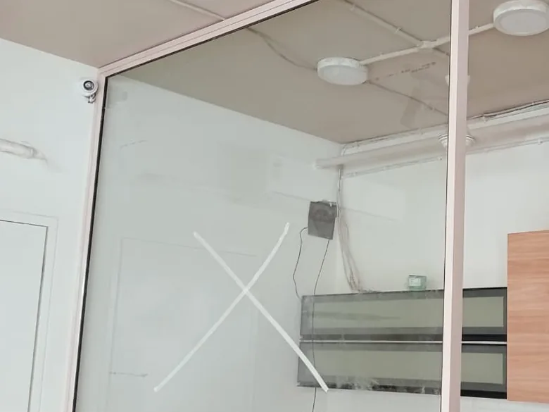 Clear glazed partition between a kitchen and the next room