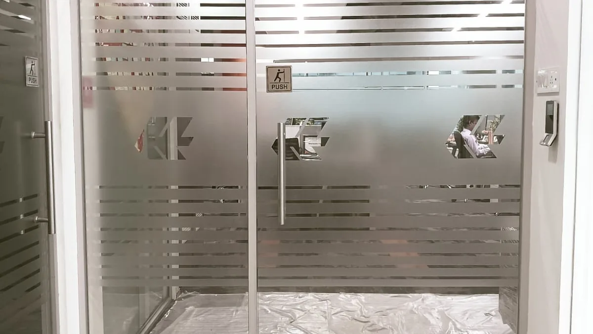 Toughened glass door with a striped frosted band