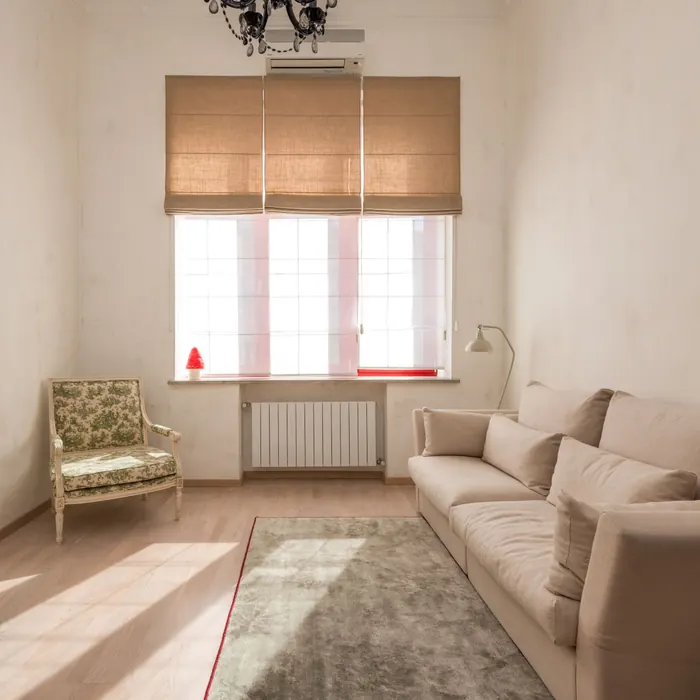 Roman blind folded above a living room window