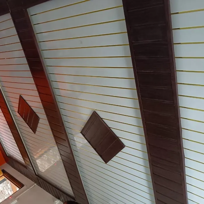 PVC ceiling planks fitted between timber beams