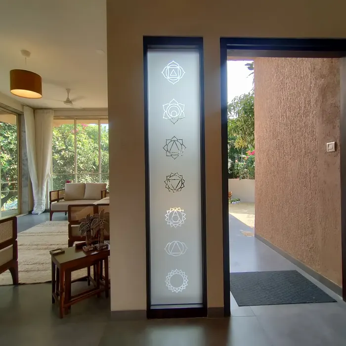 Decorative glass panel beside a timber entrance door