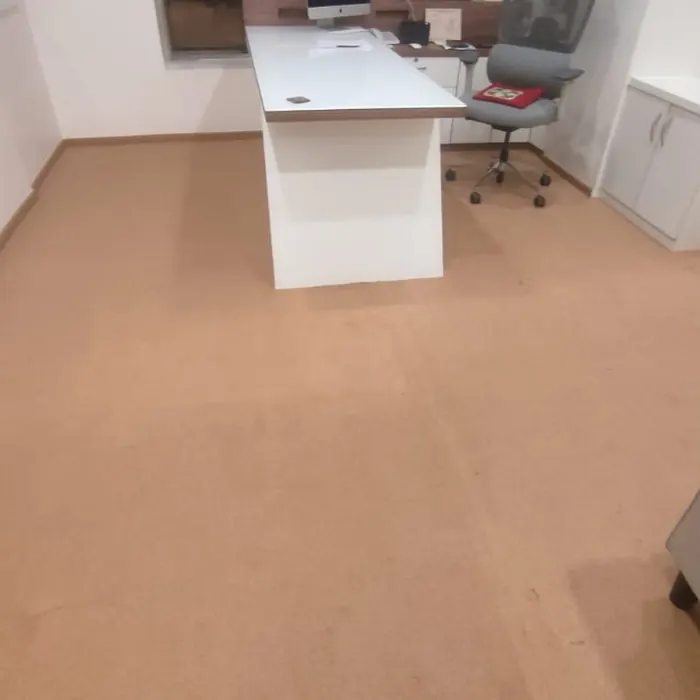 Office carpet running beneath a workstation