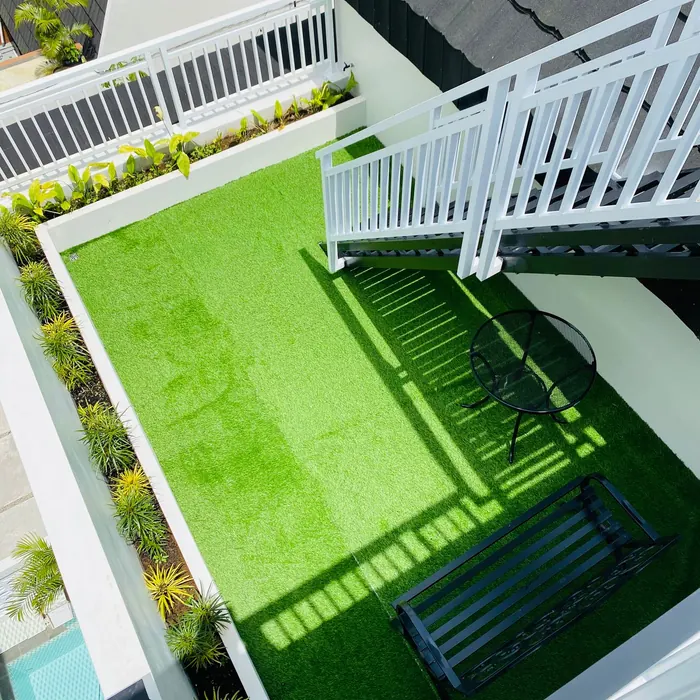 Artificial grass laid across a rooftop terrace