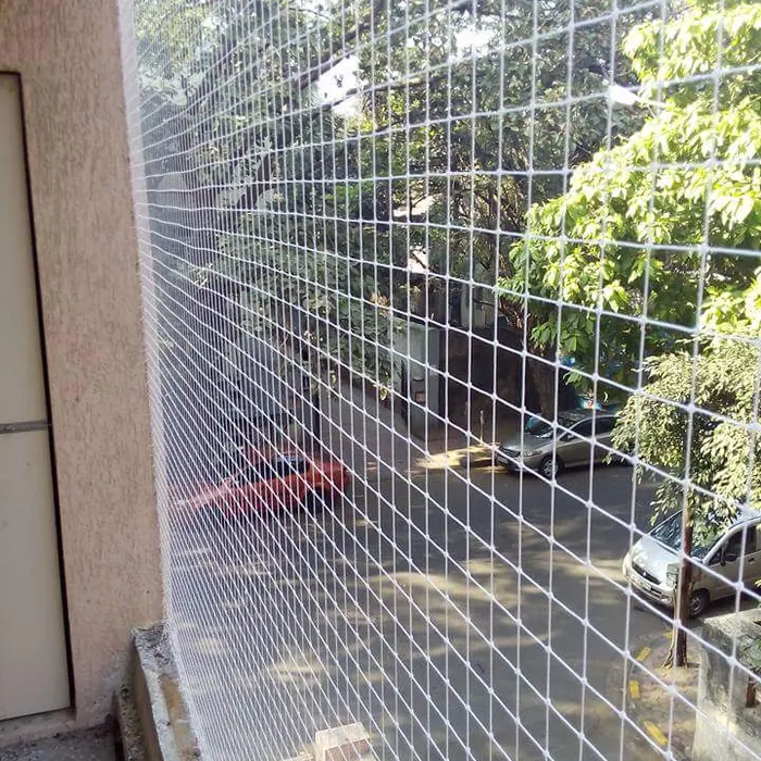 Invisible grille cables across a balcony opening