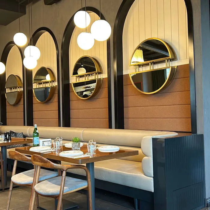 Arched mirror panels lining a restaurant wall