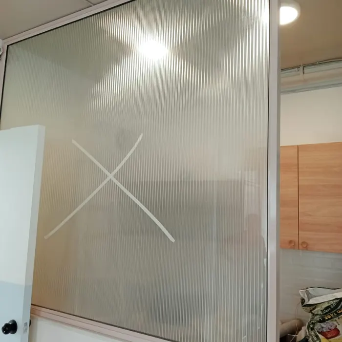 Reeded film applied to the same kitchen partition