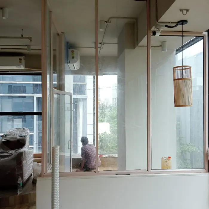 Reeded film partition framing an office workspace