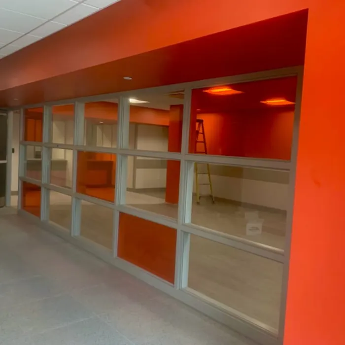 Coloured film panels along a school corridor