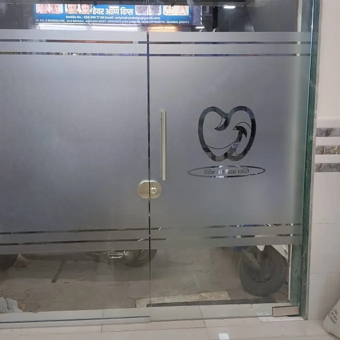 Etched glass shower cubicle in a tiled bathroom