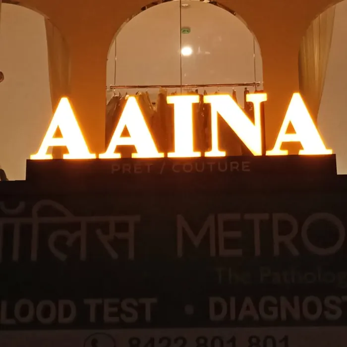 Halo-lit boutique lettering above a shopfront