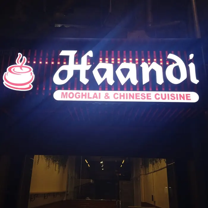 Neon-lit restaurant sign glowing after dark