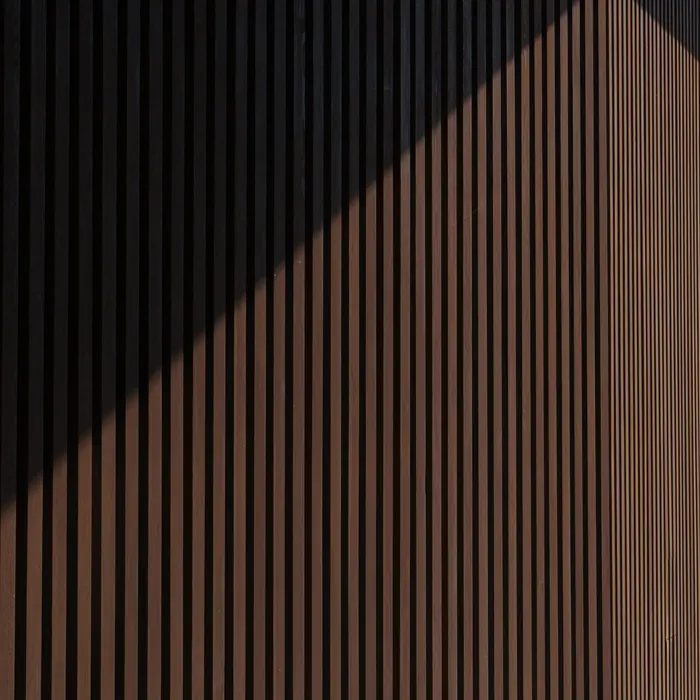 Vertical slat panelling catching raking light