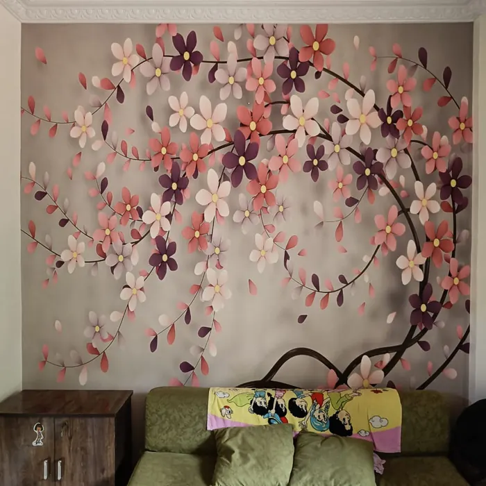 Blossom branch mural behind a bedroom sofa