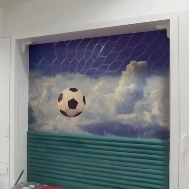 Football mural above a child's bed