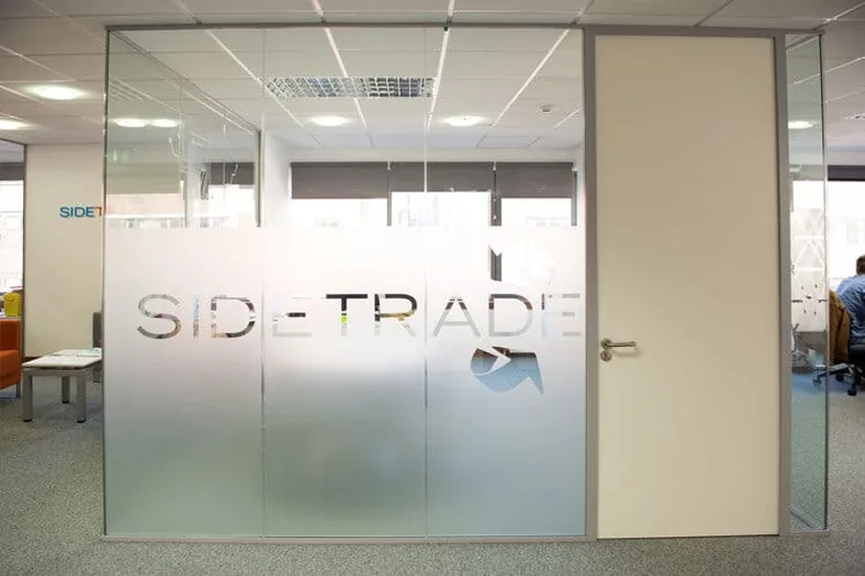 Office cabins frosted to full height with the company name cut into the film