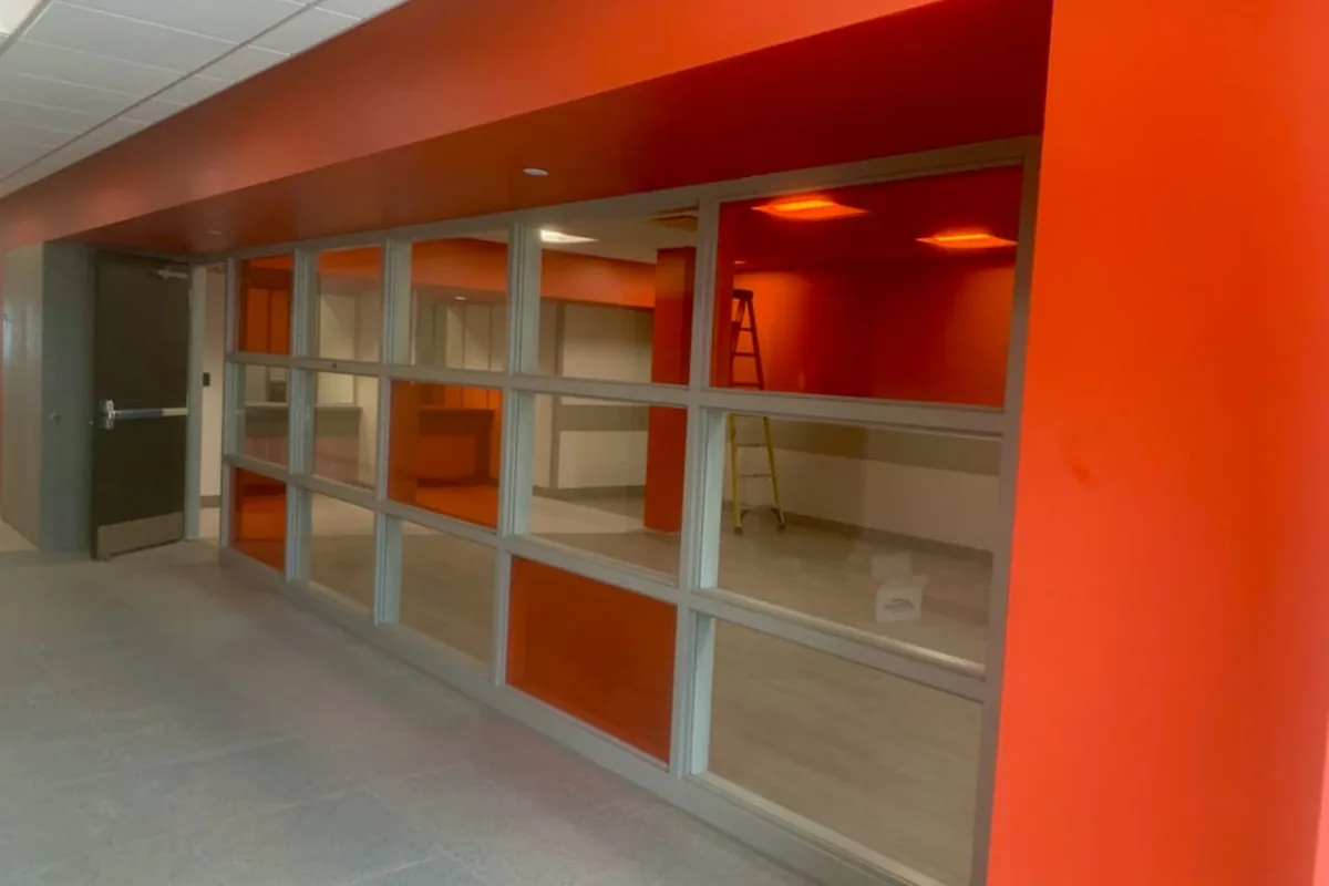 Safety film on corridor glazing — School building