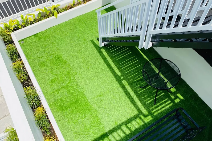 Artificial grass laid across a rooftop terrace