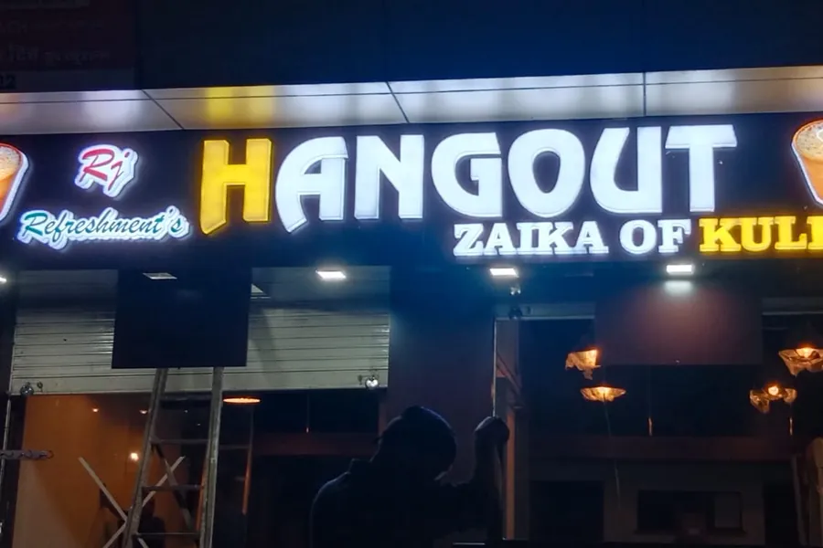 Illuminated 3D letters above a snack bar frontage