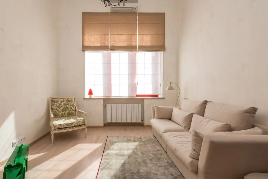 Roman blind folded above a living room window