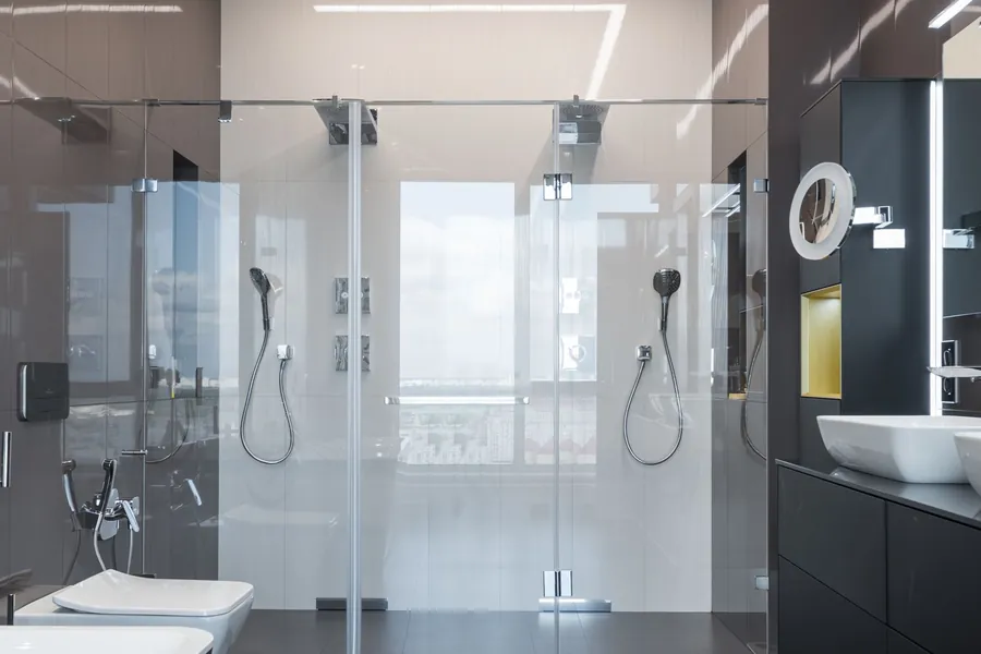 Frameless toughened glass shower enclosure in a modern bathroom