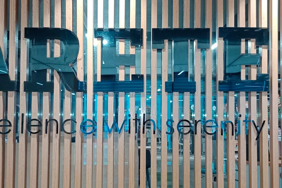 Fluted louver panelling running behind reception lettering